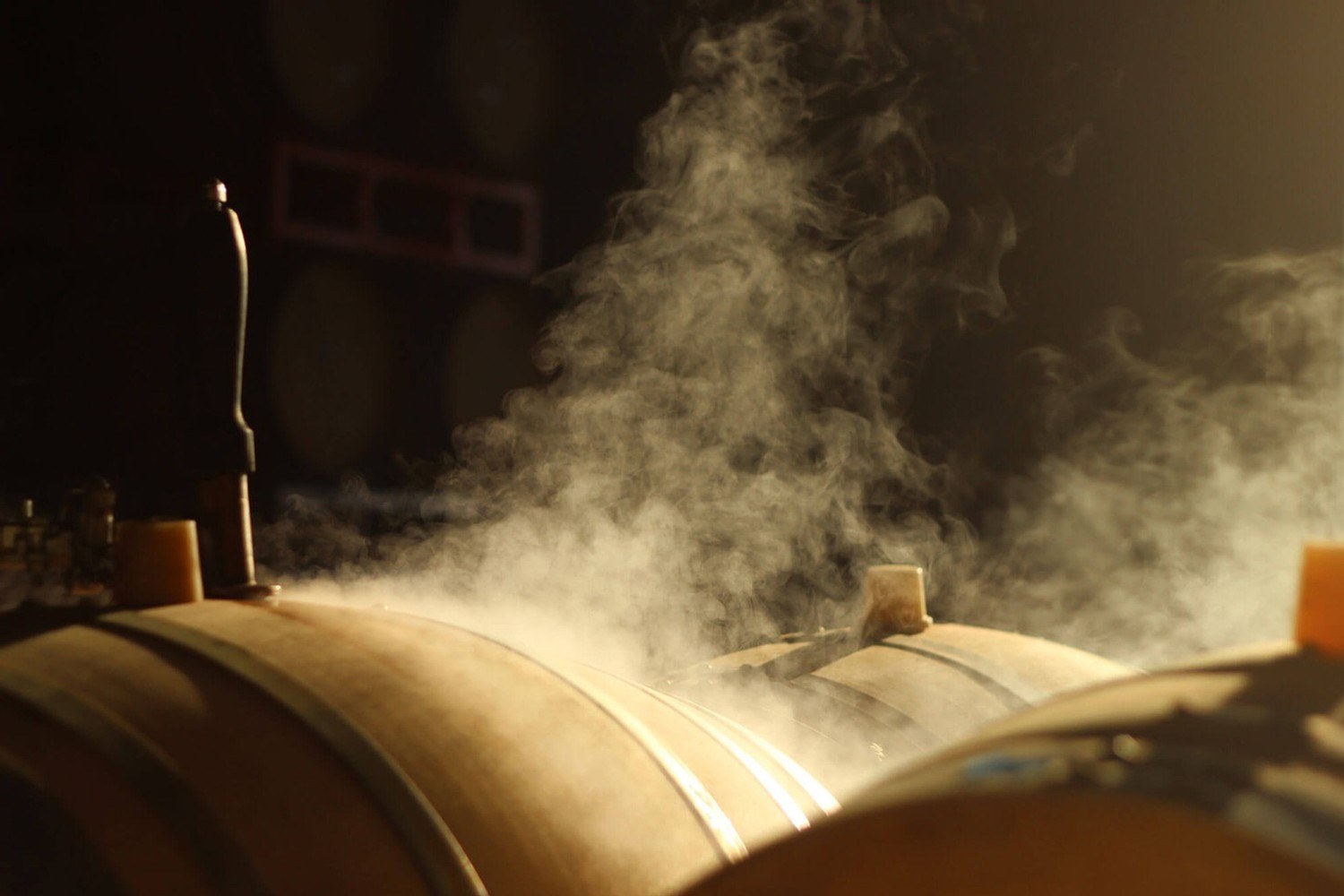 Niner barrels being steam-cleaned at the winery
